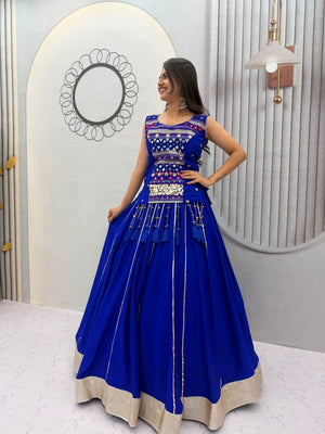 Model Posing Indoors Wearing Royal Blue Pure Cotton Mirror Hand Work & Ribbon Work Navratri Lehenga Choli Set By The Beauty Queen