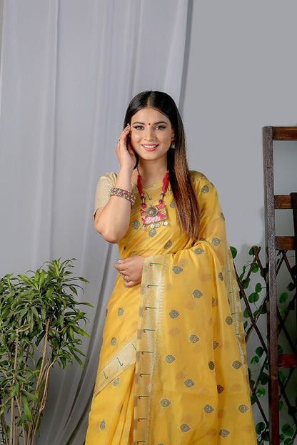 Yellow Paithani Saree In Organza Smooth Fabric With Rich Weaving And Cotton Tassles On Pallu