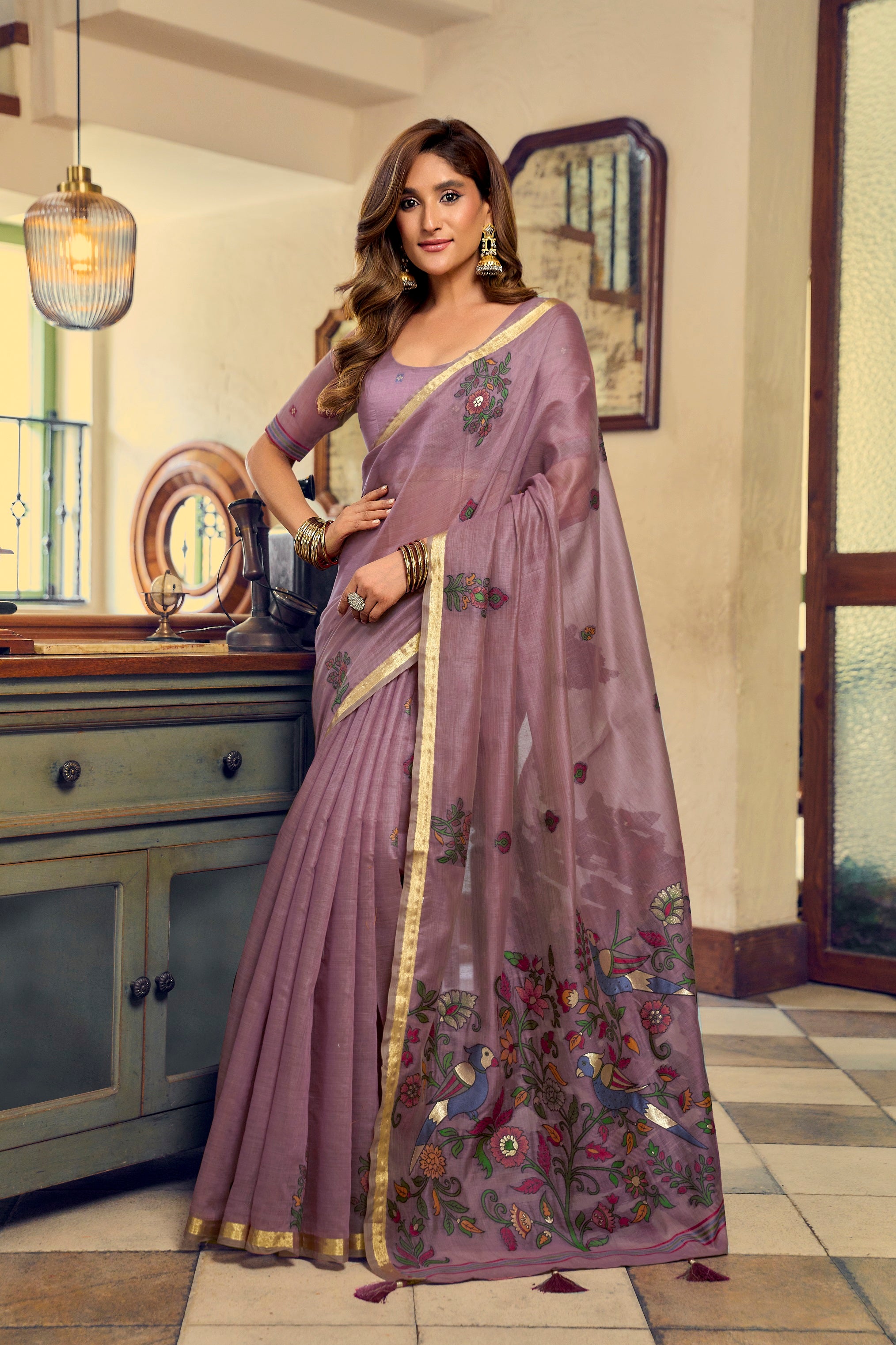 Mauve Kolkata Cotton Saree featuring colorful floral litchi work and fancy tassels by The Beauty Queen Surat.
