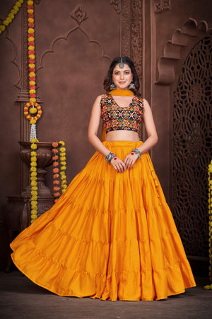 Yellow French Crape Navratri Lehenga Choli with multi-color Kutchi embroidery and mirror work blouse by The Beauty Queen 