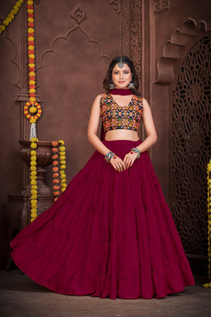 Maroon French Crape Navratri Lehenga Choli with multi-color Kutchi embroidery and mirror work blouse by The Beauty Queen India