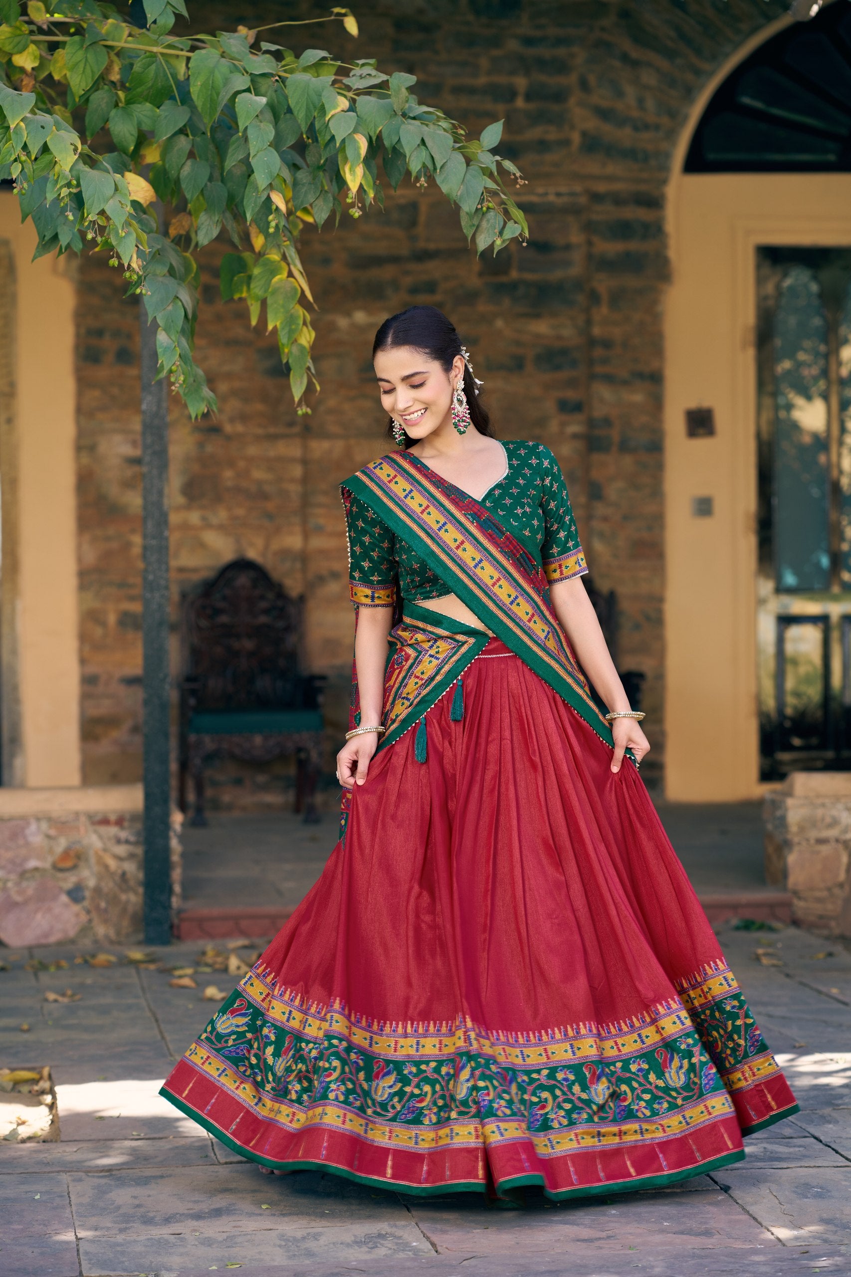 Maroon and Green Tasar Silk Navratri Lehenga Choli featuring iconic sparkle and peacock printed work by The Beauty Queen