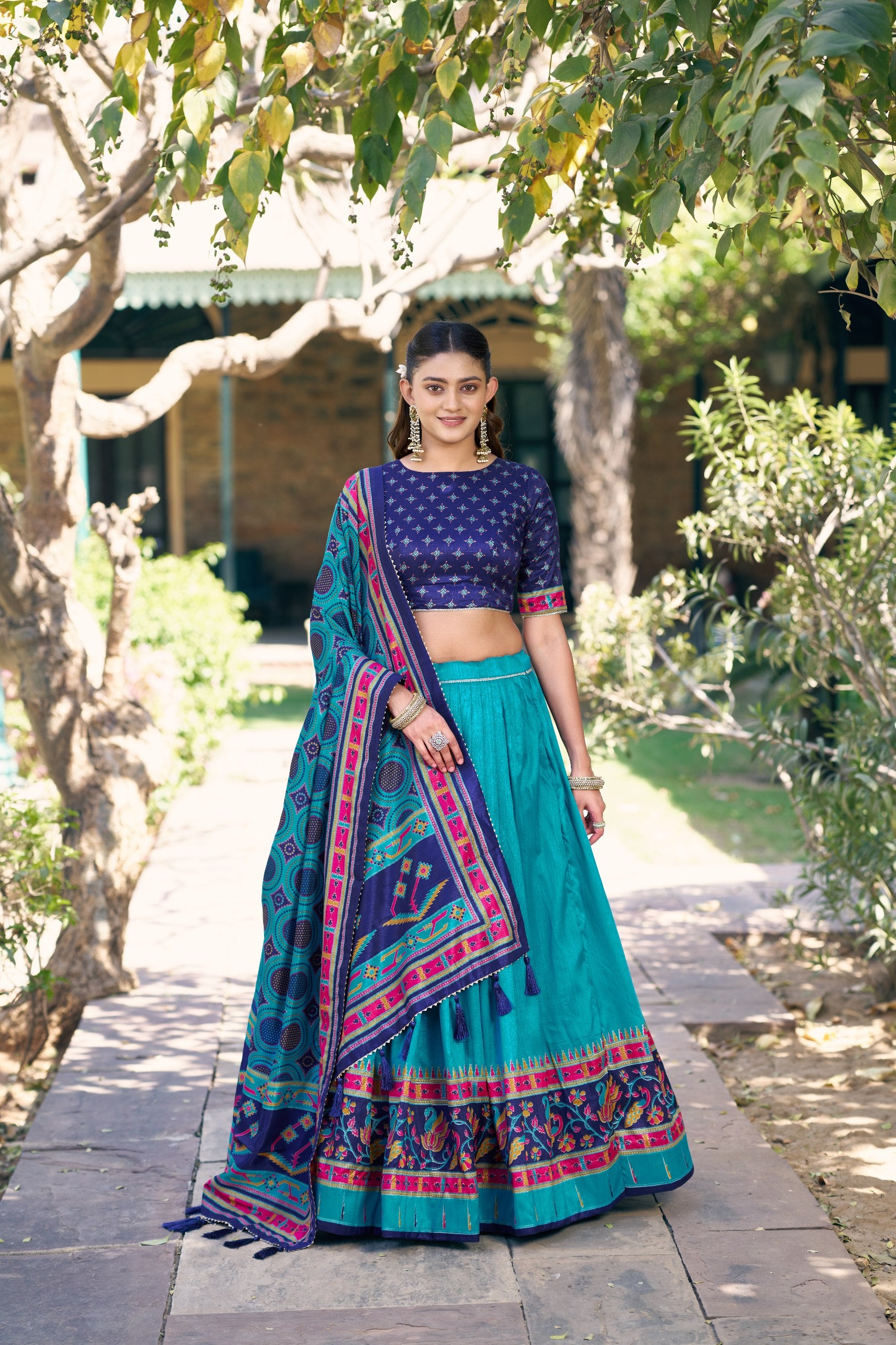 Rama Blue and Navy Blue Tasar Silk Navratri Lehenga Choli featuring iconic sparkle and peacock printed work by The Beauty Queen