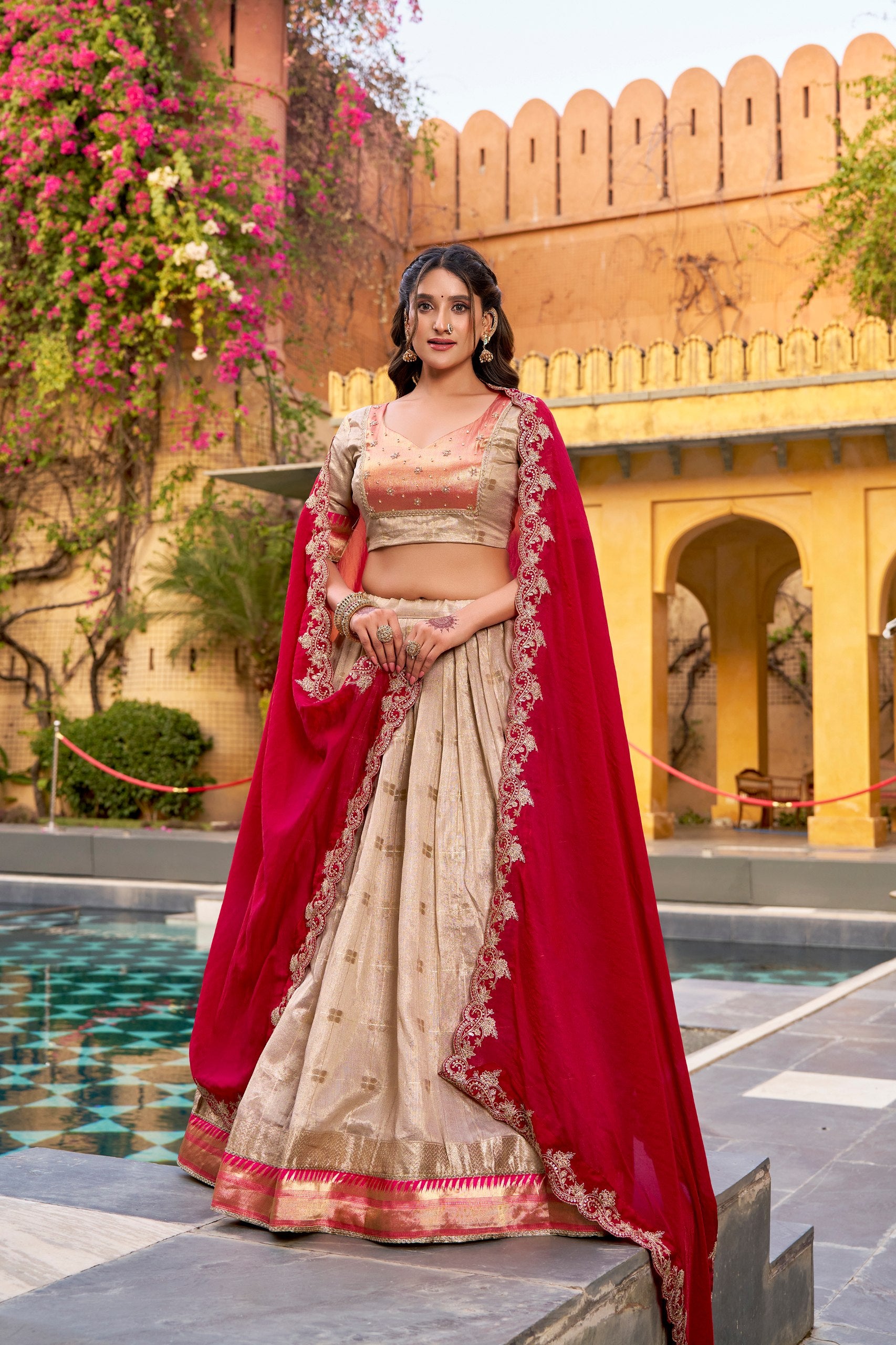 Zari woven gold lehenga with rani pink dupatta

