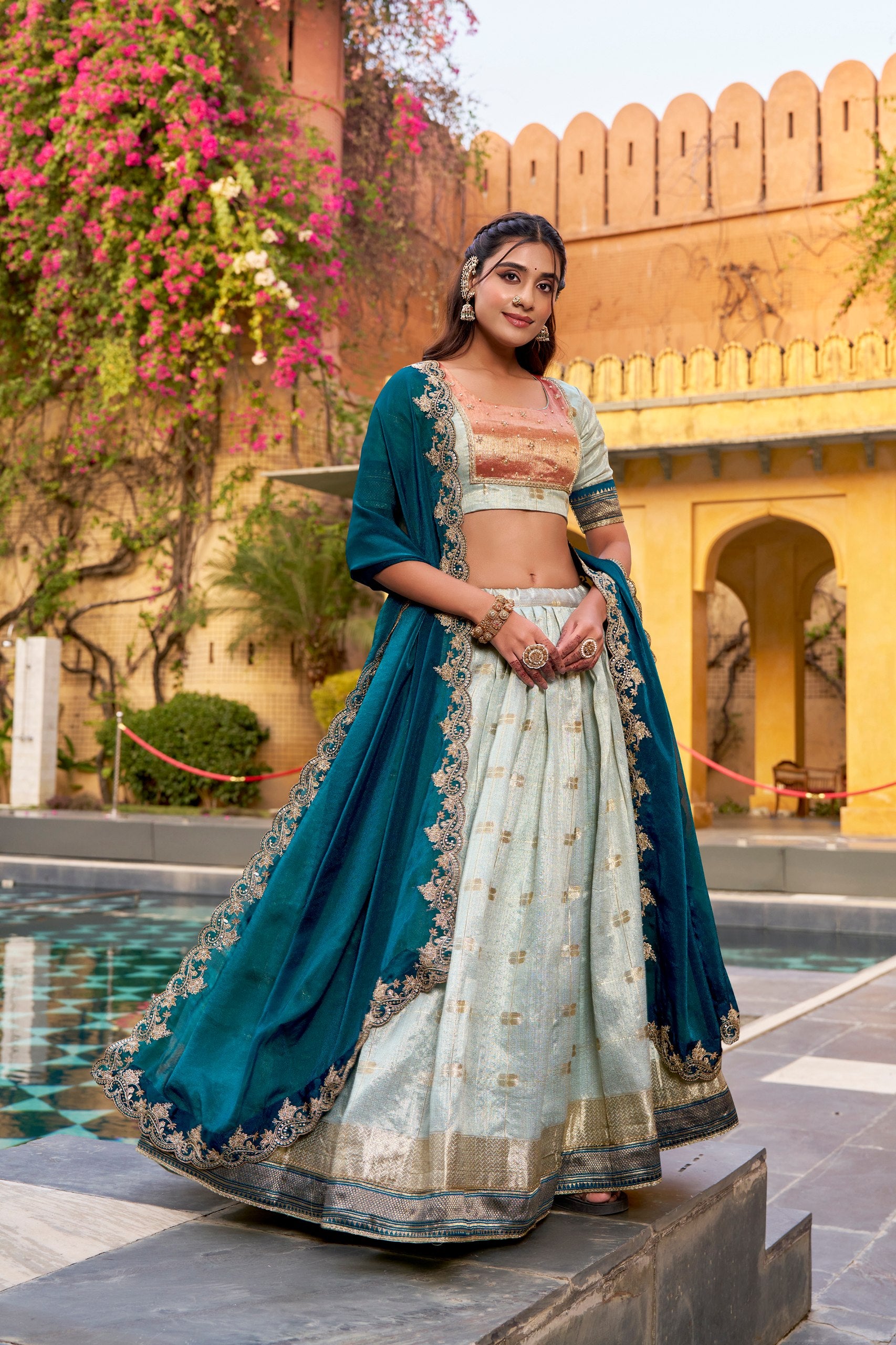 Mint green slub Kota lehenga choli with gold zari weaving
