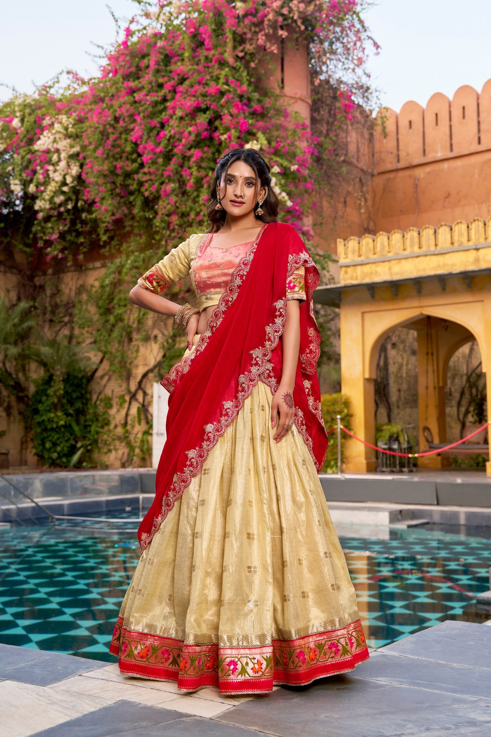 Zari woven cream lehenga with floral Paithani border
