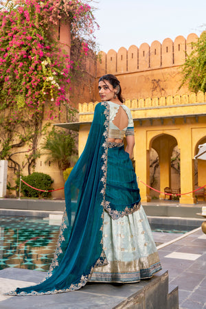 Zari woven mint lehenga with teal organza dupatta
