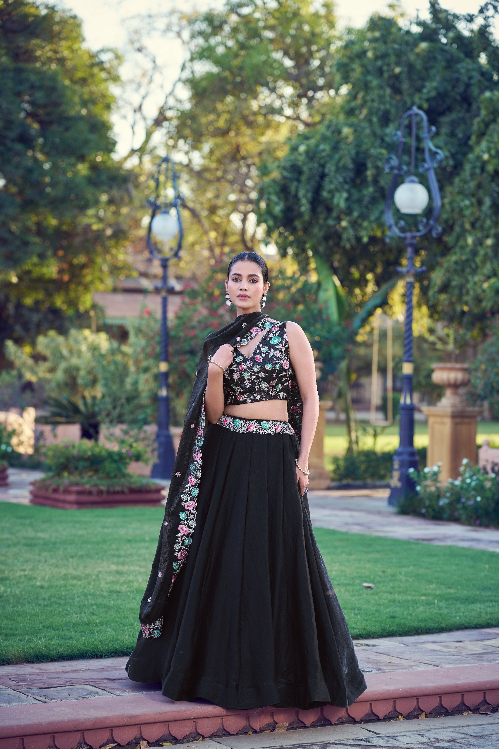 Modern black sangeet lehenga choli with floral embroidery
