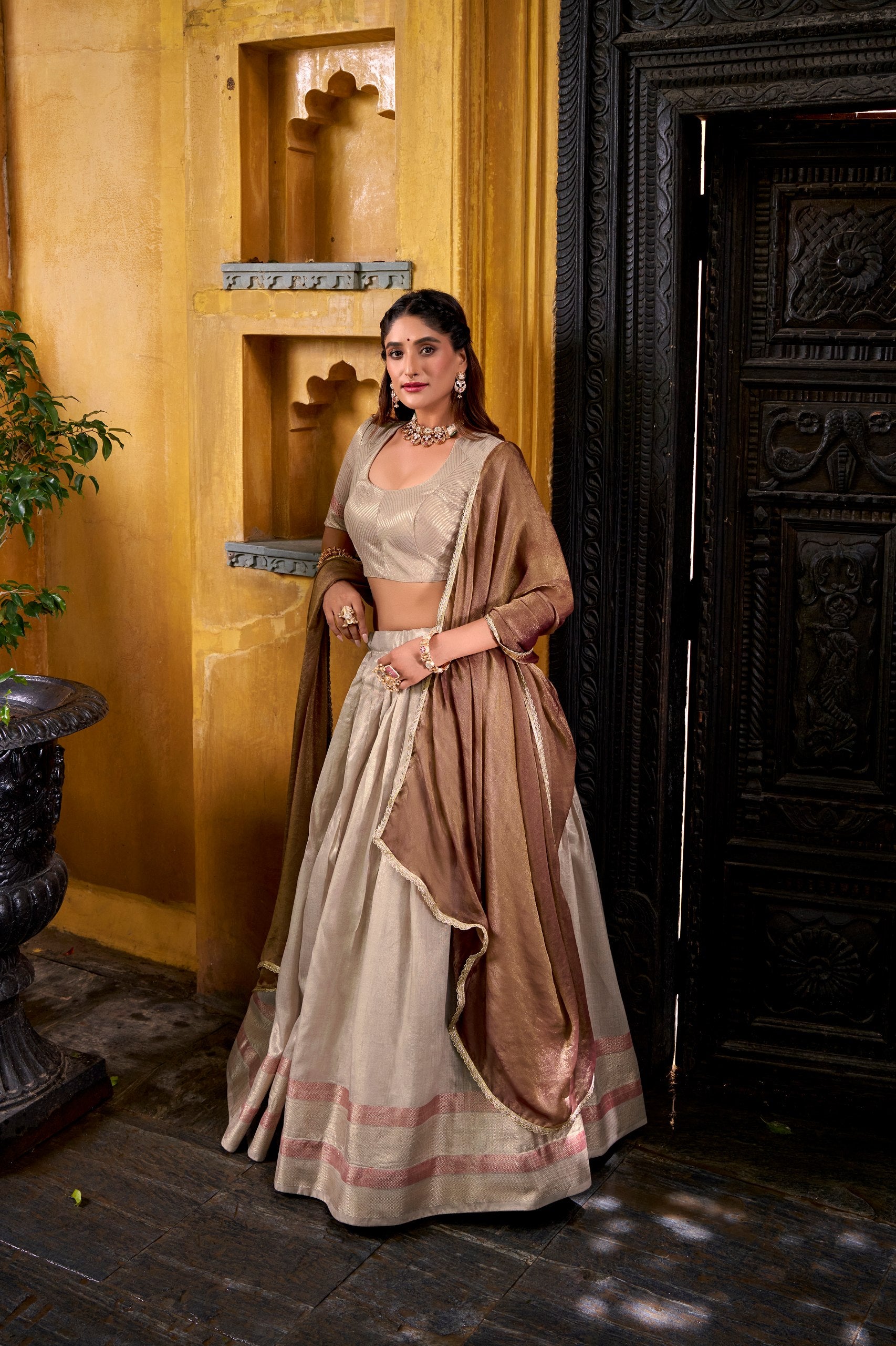 Designer champagne lehenga saree with zari weaving
