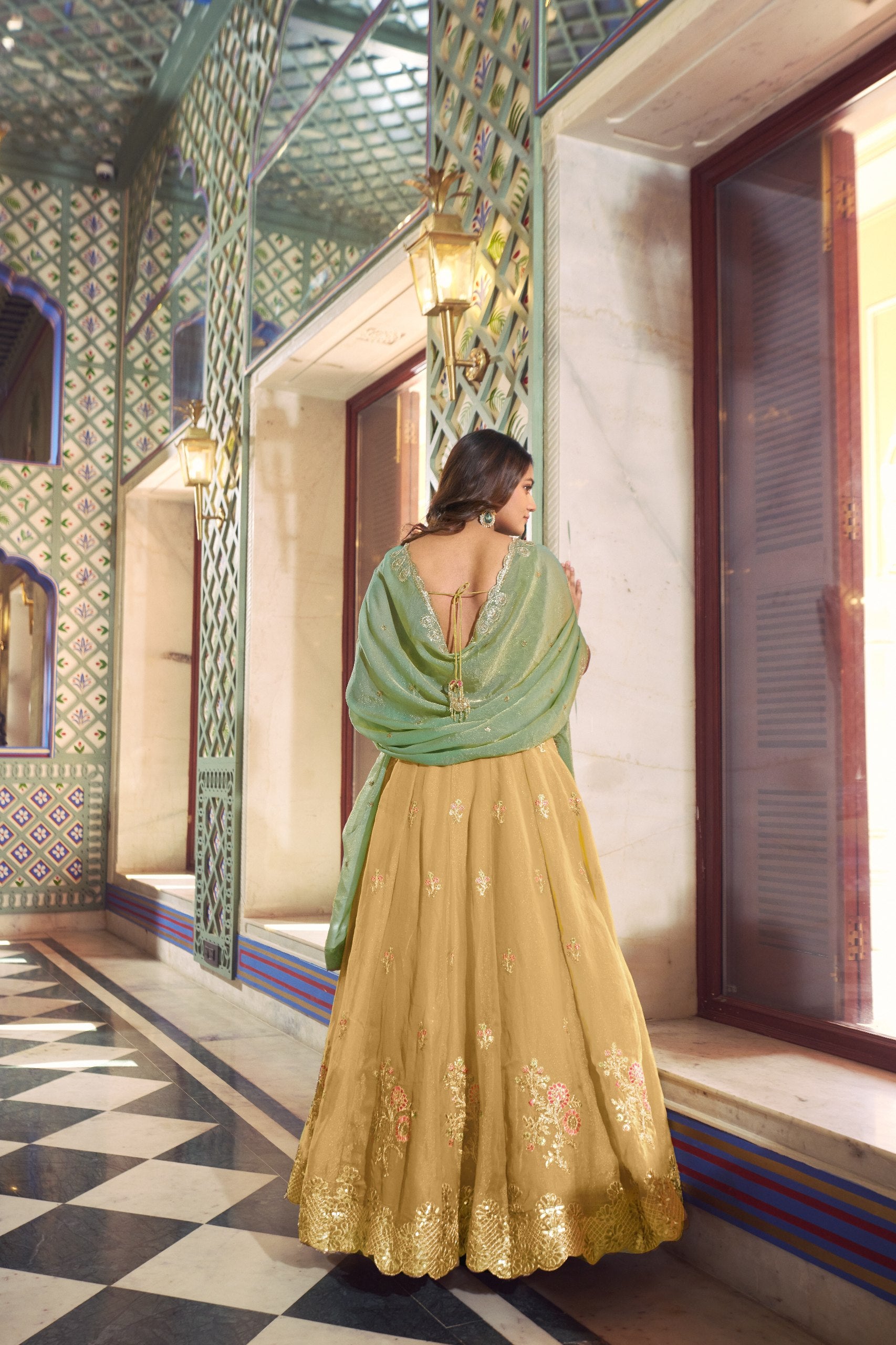 Yellow floral embroidered lehenga with potli bag
