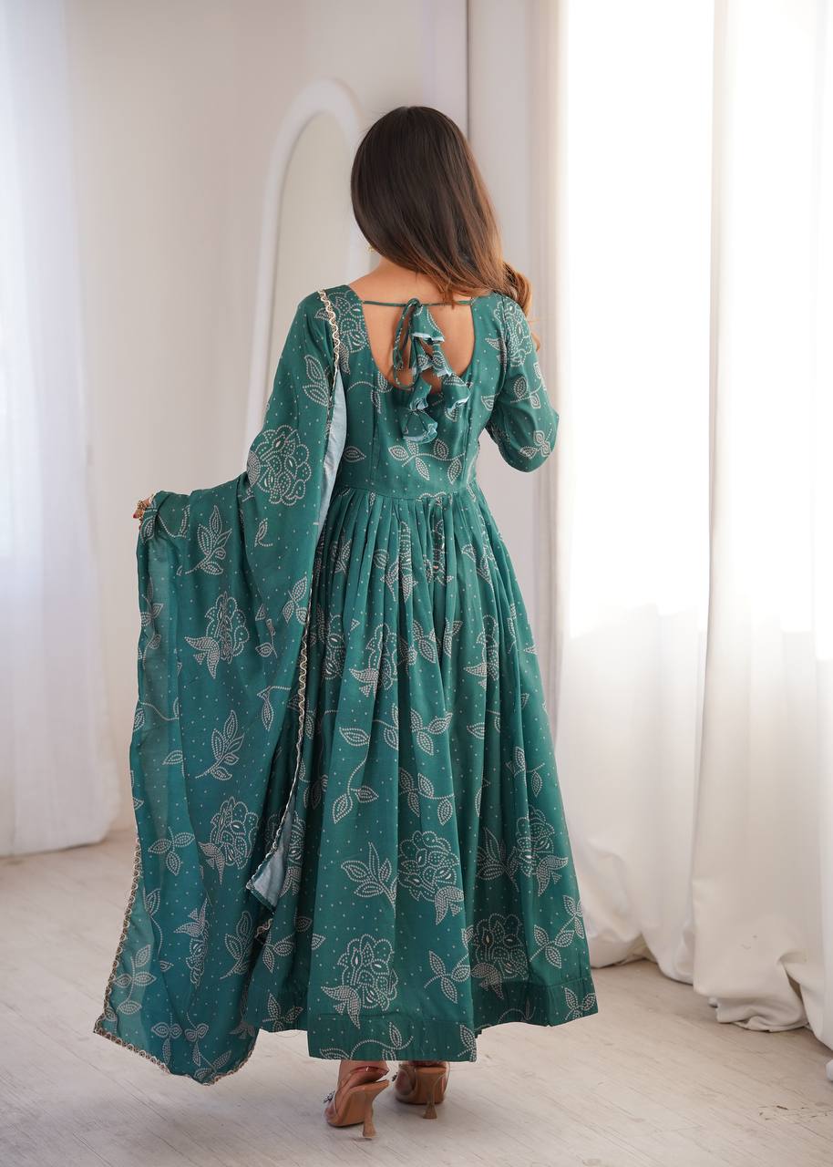 Designer green muslin Anarkali set with lace trim
