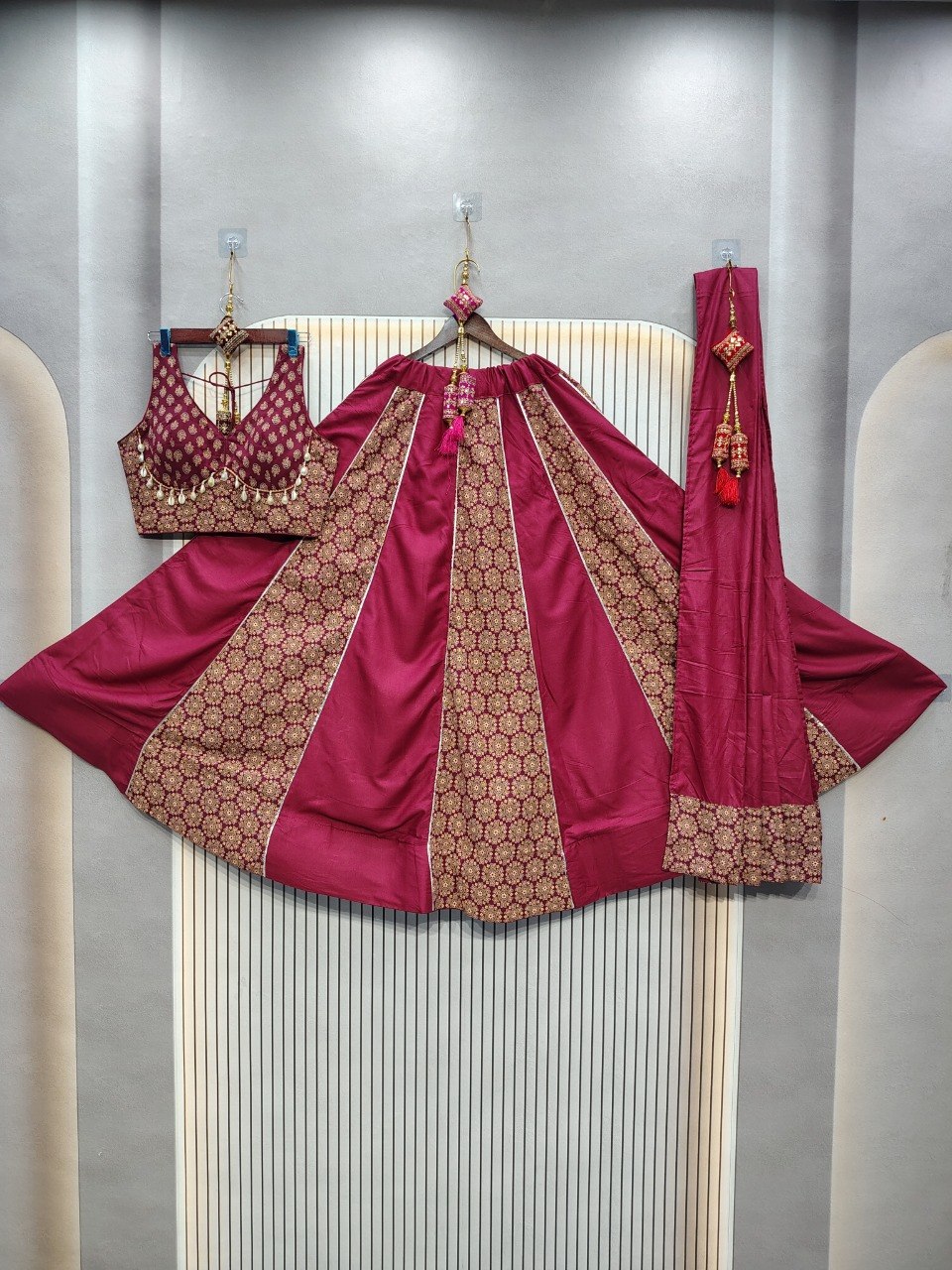 Festive maroon Navratri lehenga with gold lace trim
