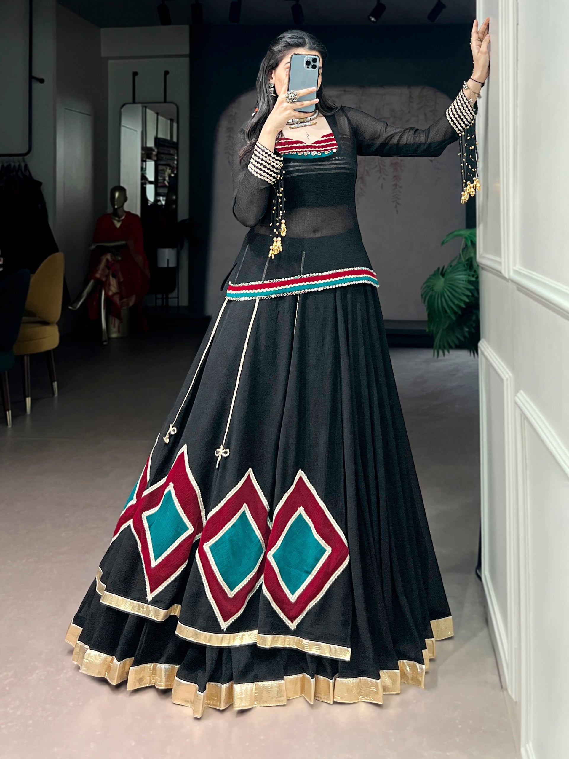 Modern Navratri lehenga black marble with traditional gold border
