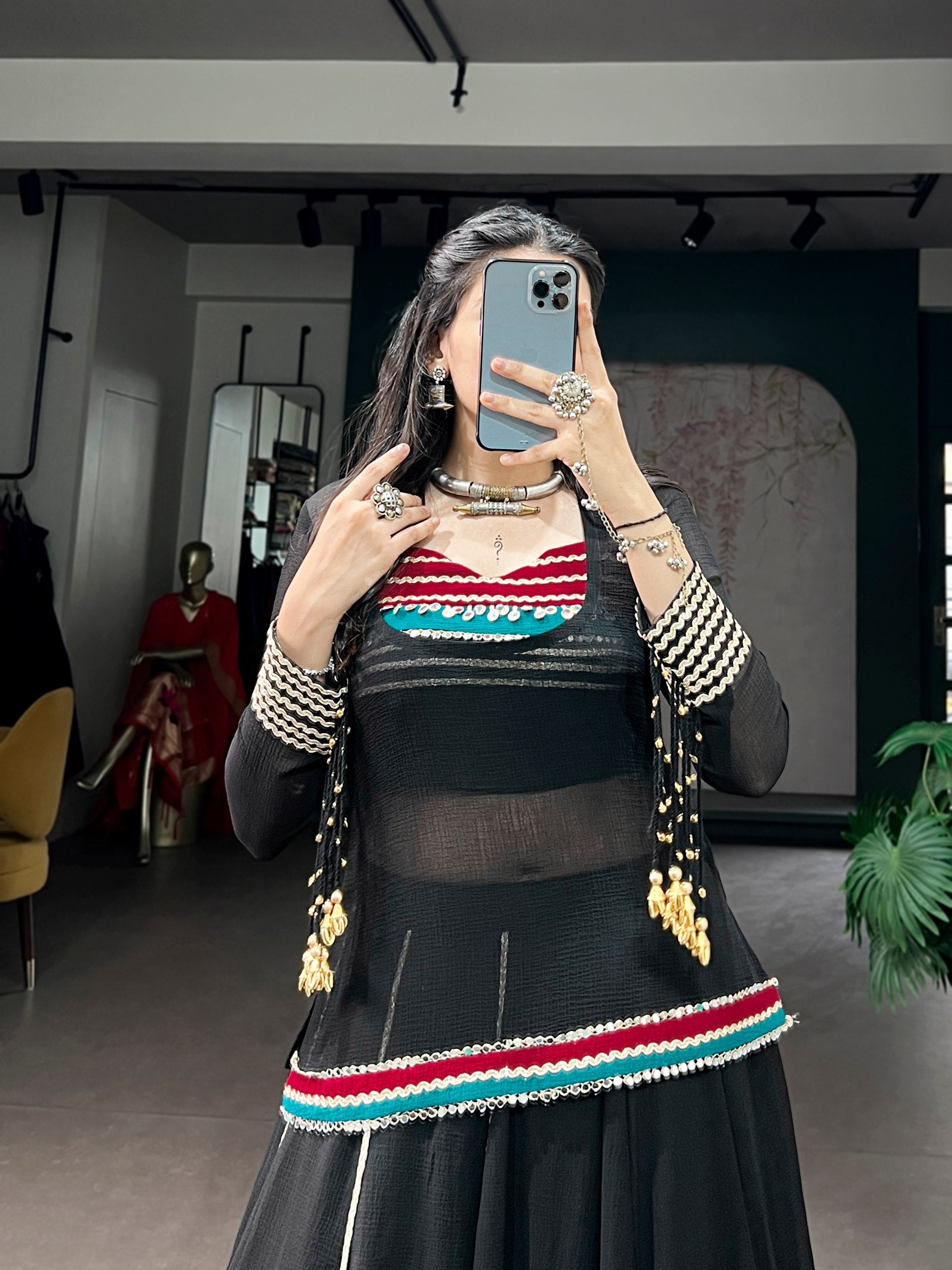 Garba lehenga black with red teal diamond motifs and gold lace
