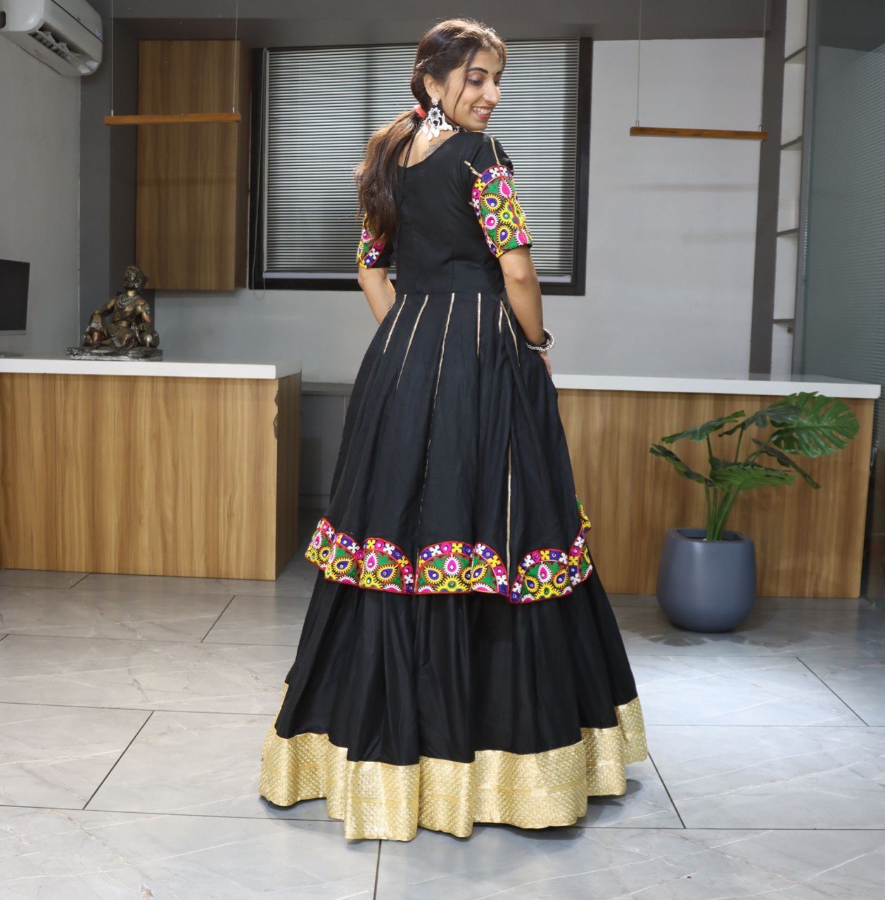 Designer black chaniya choli with multicolor Kutchi medallion patches
