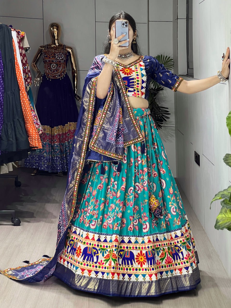 Traditional Gujarati garba lehenga with vibrant Kutchi embroidery teal navy
