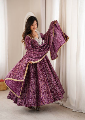 Rayon bandhani gown with gold lace dupatta for festive functions
