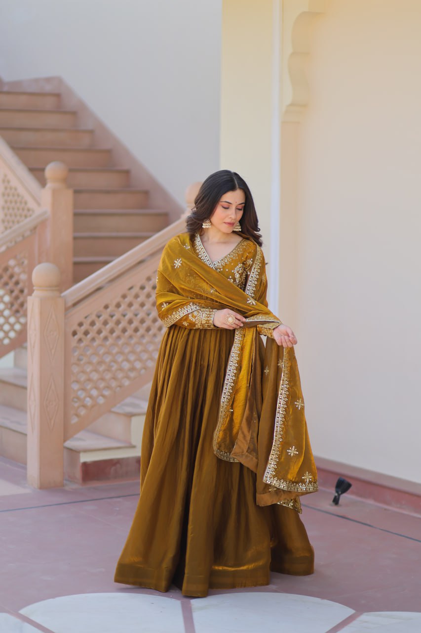 Mehandi Color Fendy Fabric With Zari Sequins Embroidered Work Gown