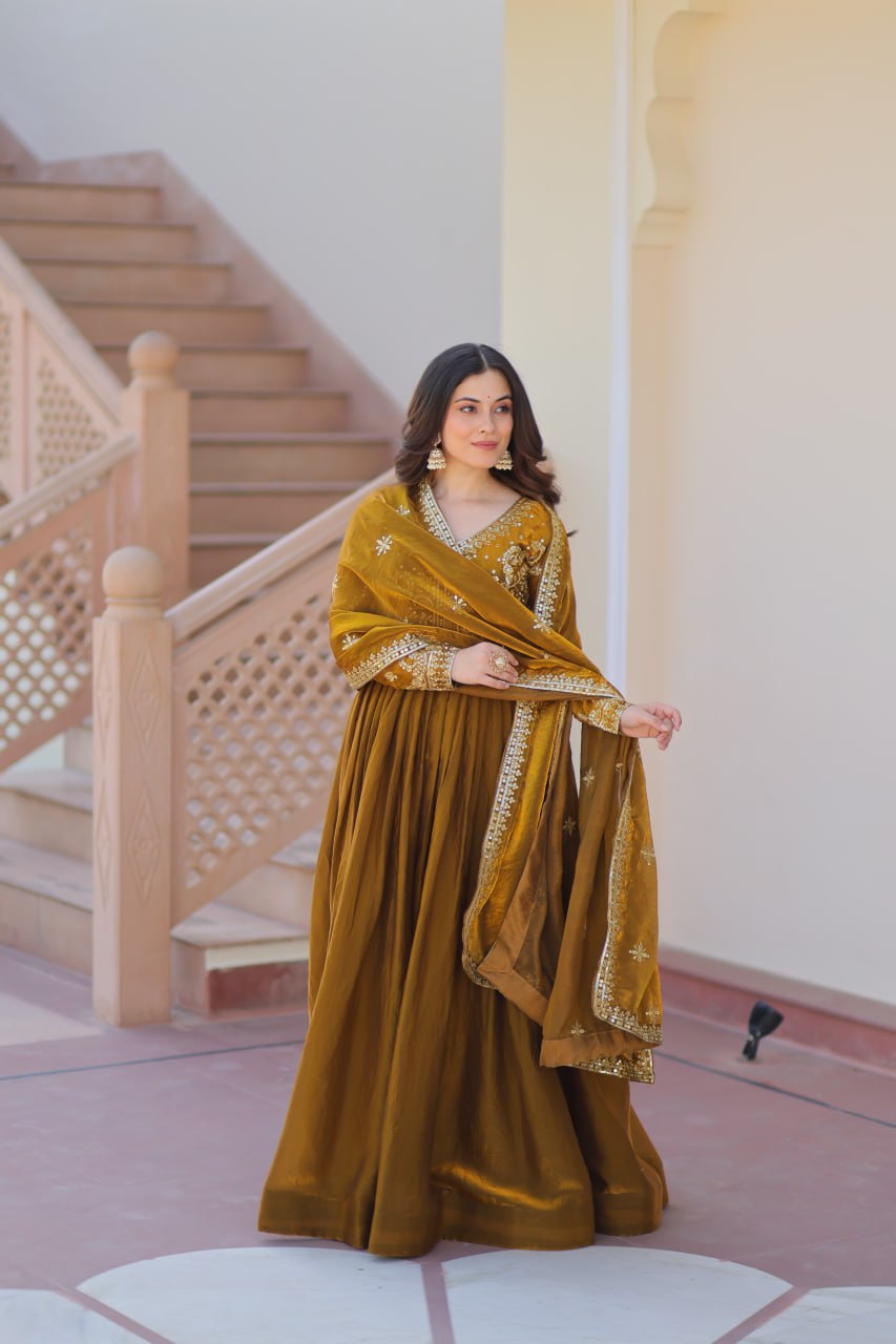 Mehandi Color Fendy Fabric With Zari Sequins Embroidered Work Gown