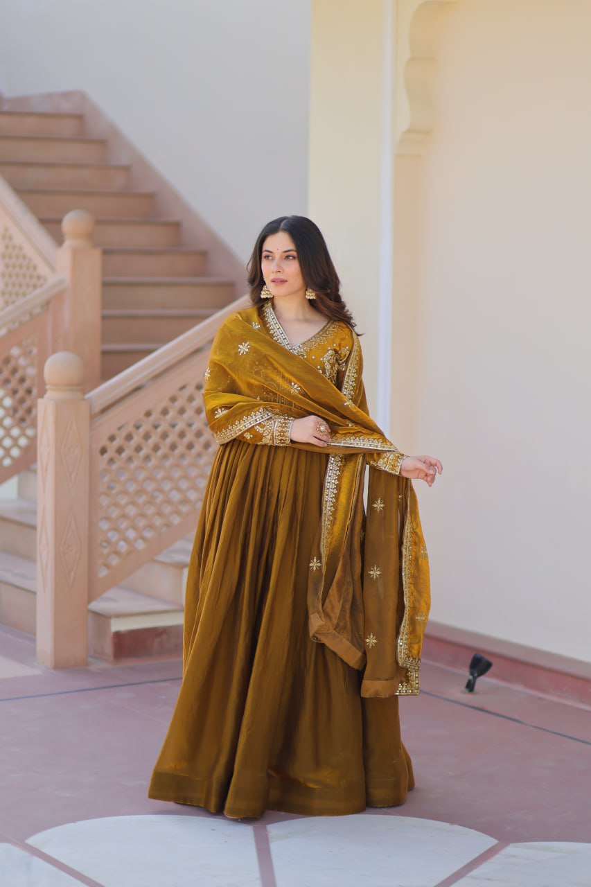 Mehandi Color Fendy Fabric With Zari Sequins Embroidered Work Gown