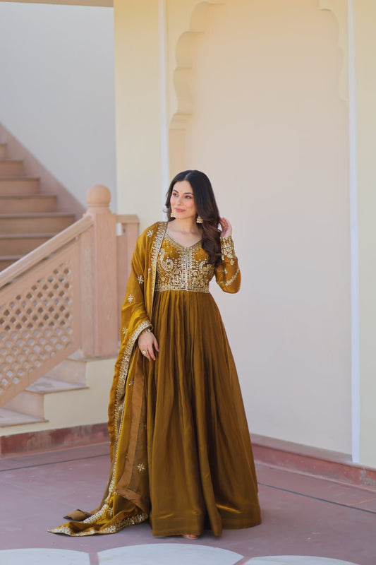 Mehandi Color Fendy Fabric With Zari Sequins Embroidered Work Gown