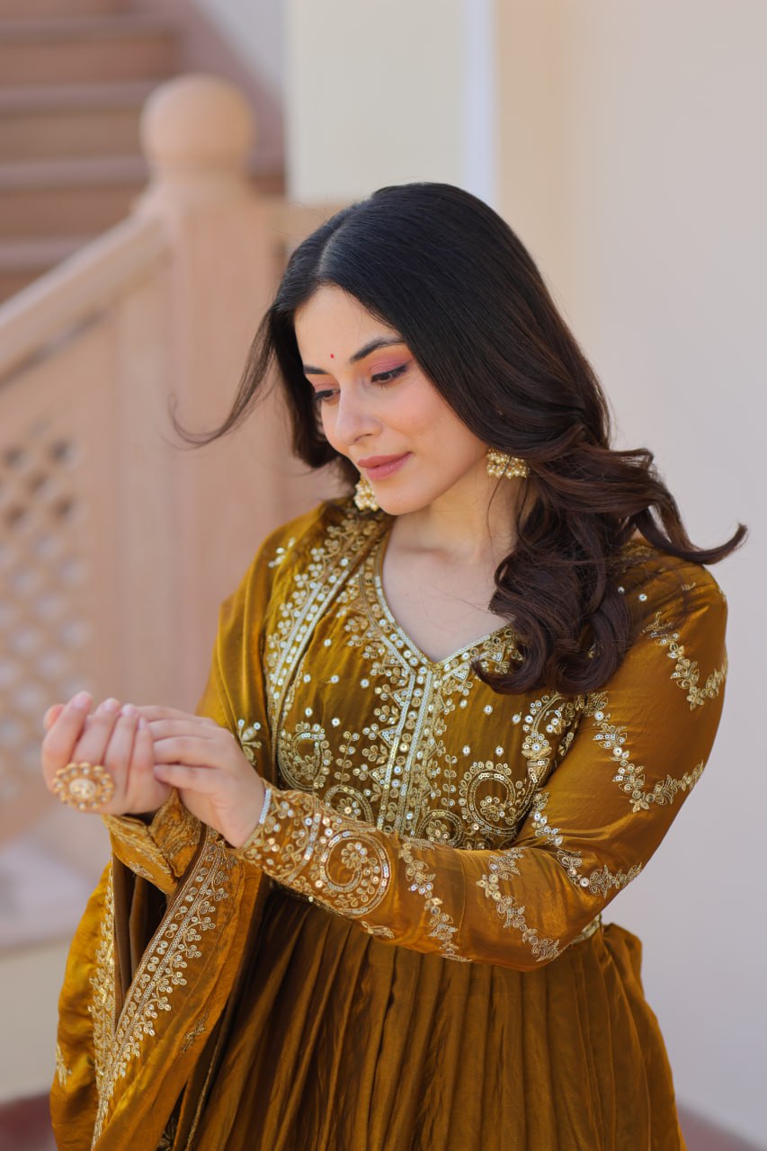 Mehandi Color Fendy Fabric With Zari Sequins Embroidered Work Gown