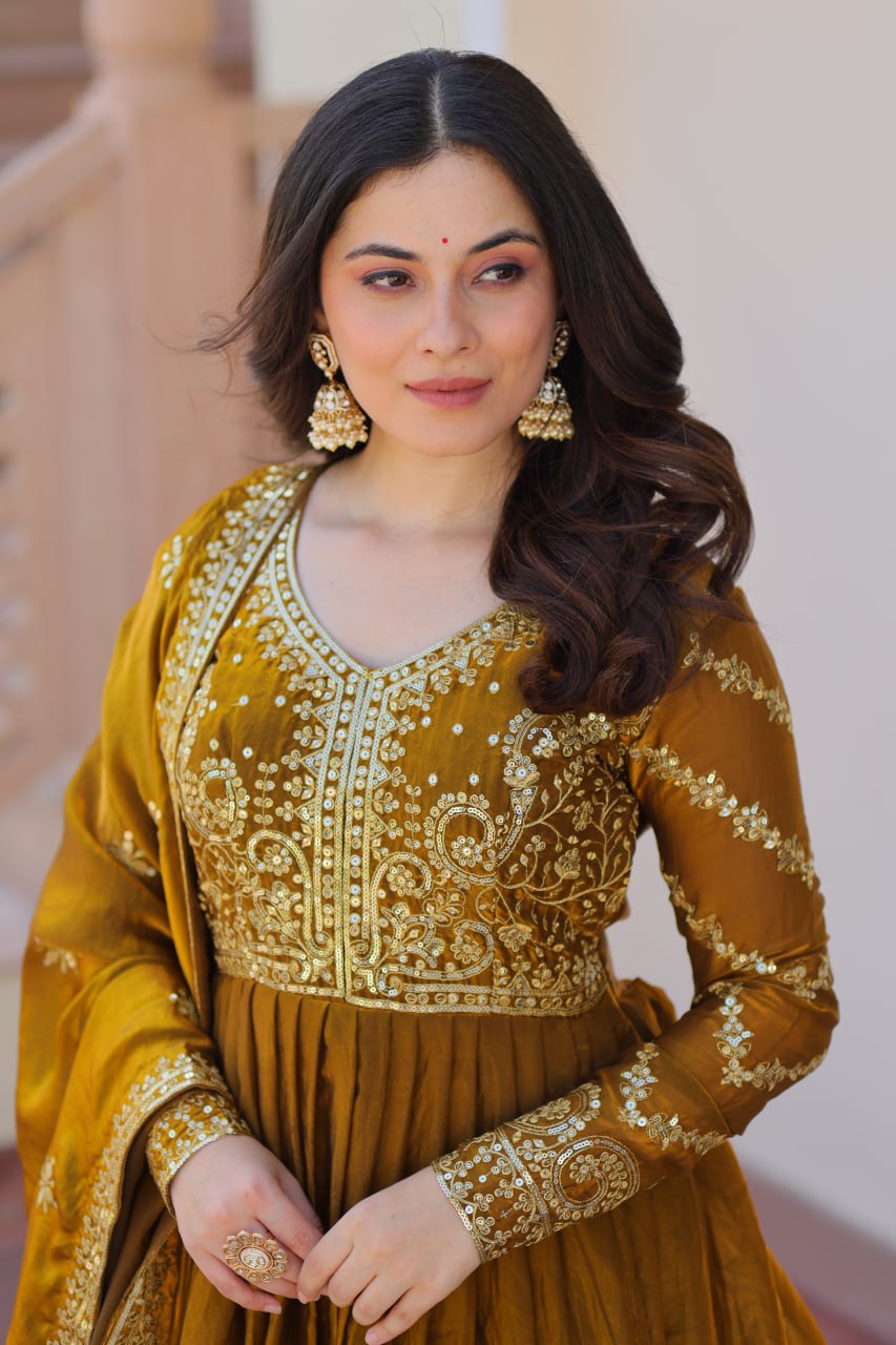 Mehandi Color Fendy Fabric With Zari Sequins Embroidered Work Gown