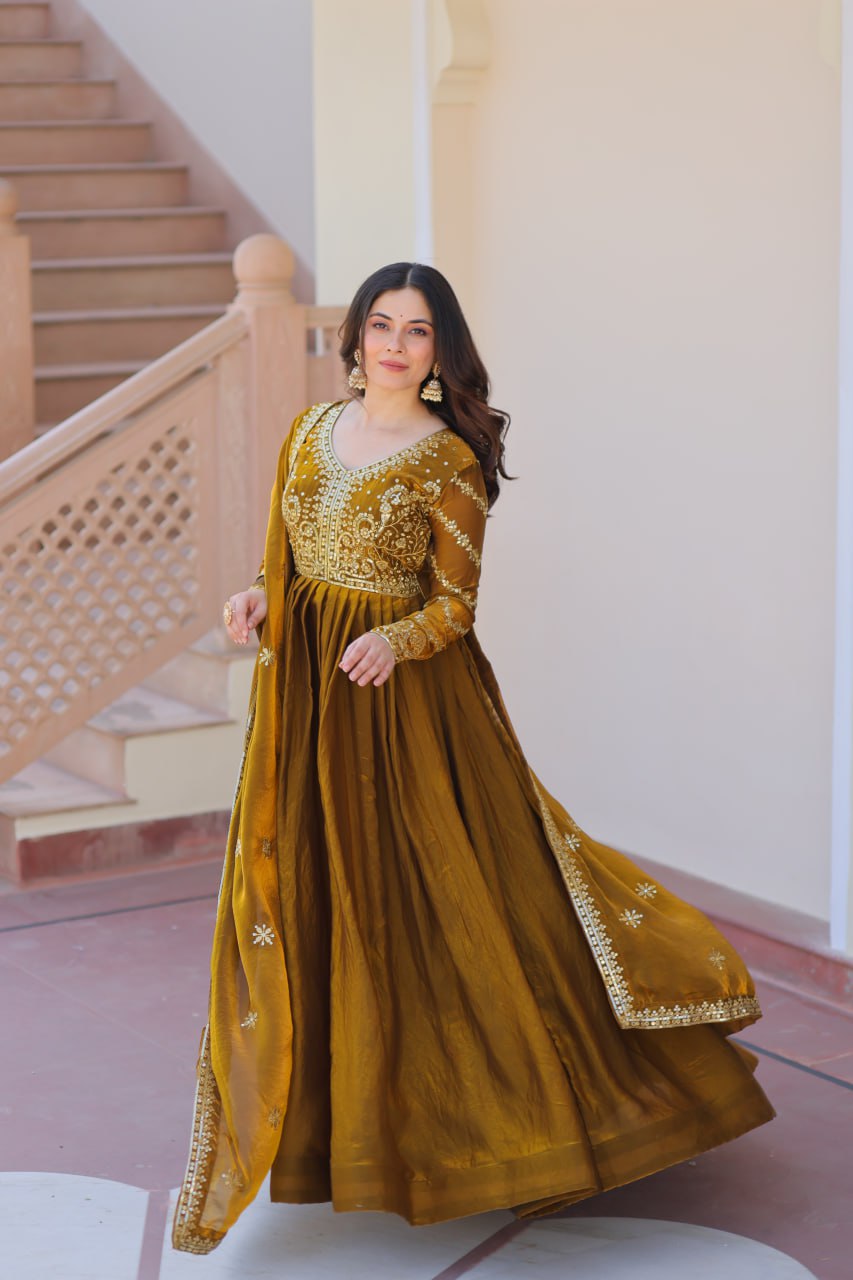 Mehandi Color Fendy Fabric With Zari Sequins Embroidered Work Gown