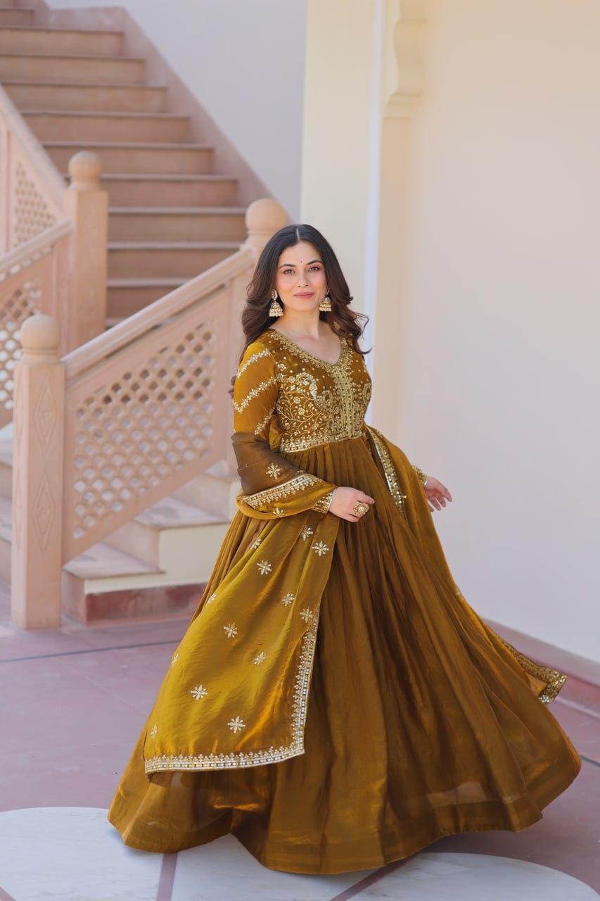 Mehandi Color Fendy Fabric With Zari Sequins Embroidered Work Gown