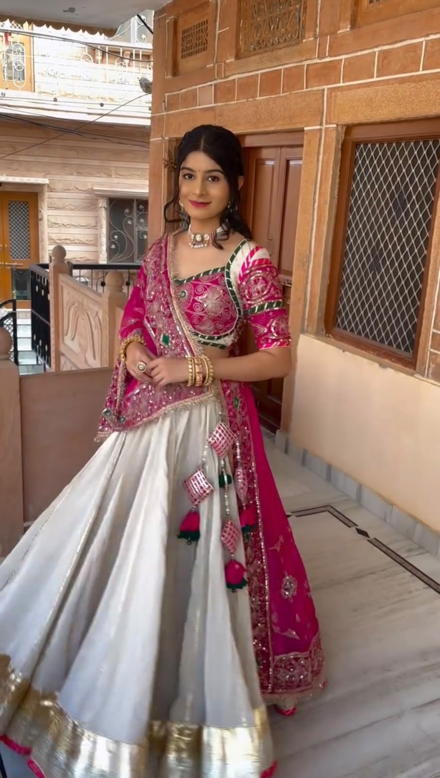 Navratri lehenga off-white roman silk with pink dupatta and latkan tassels
