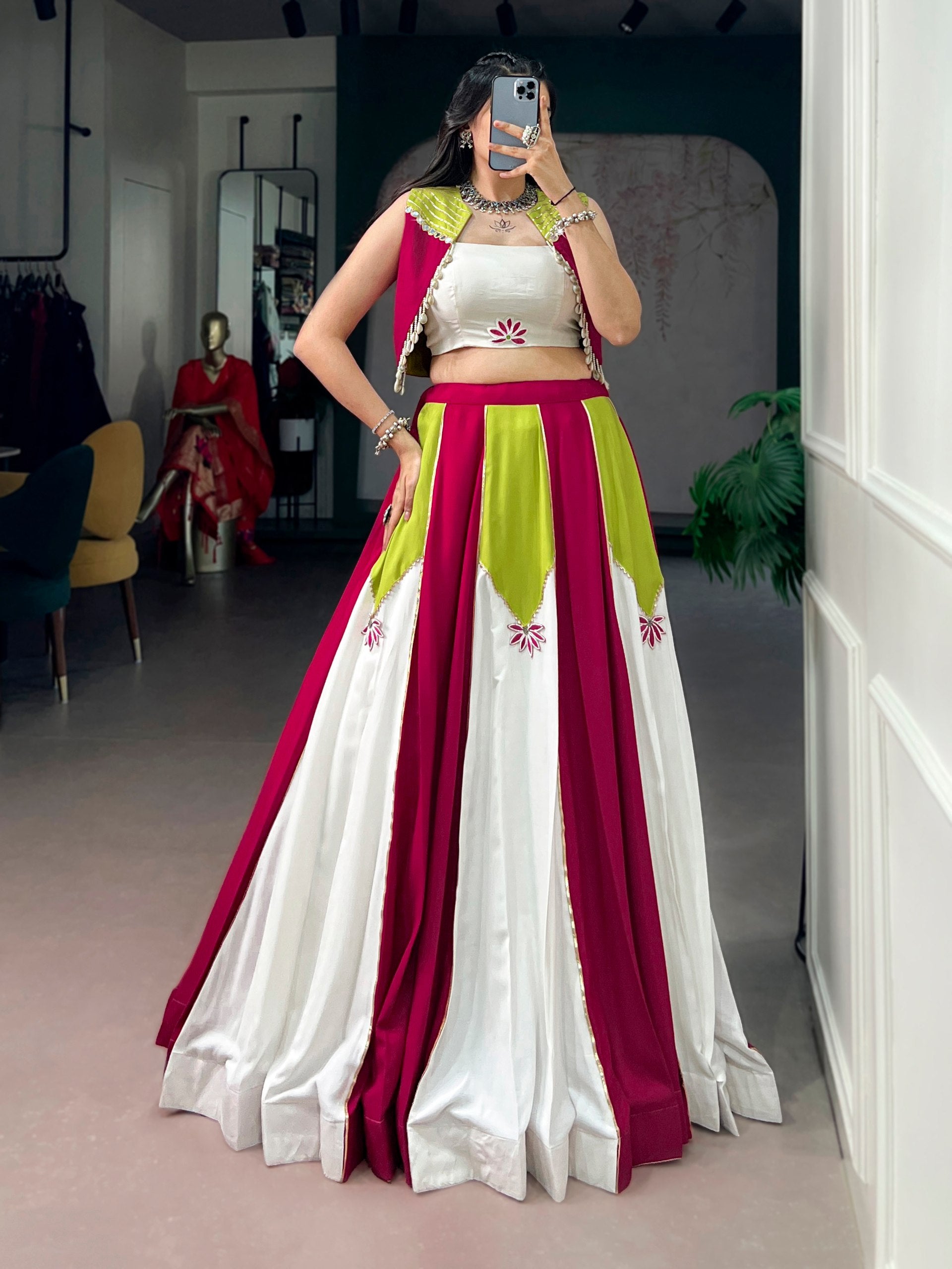 Modern Navratri lehenga with pearl and cowrie shell tassel cape
