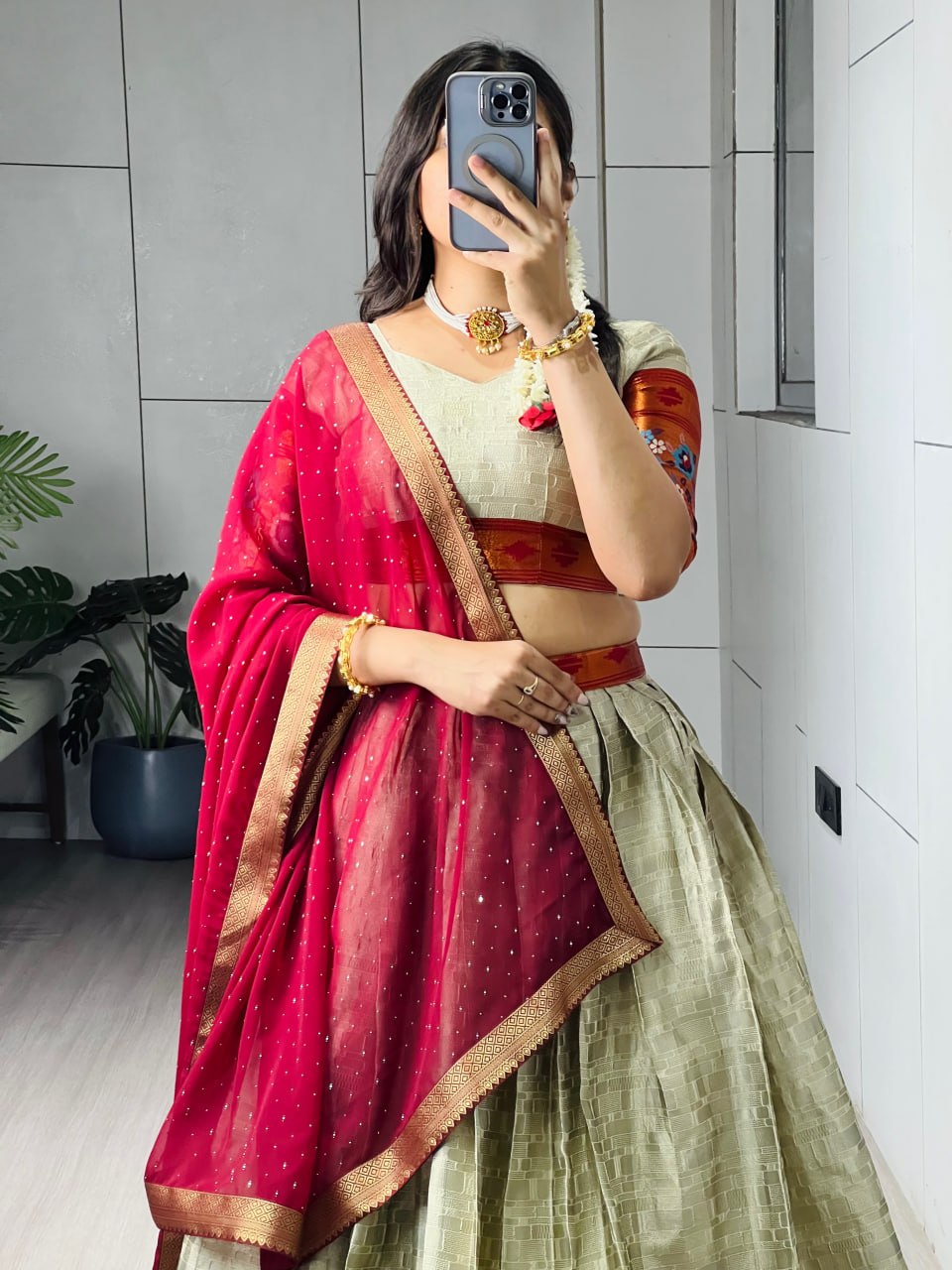 Designer South Indian lehenga with zari checks and Kalamkari motif border
