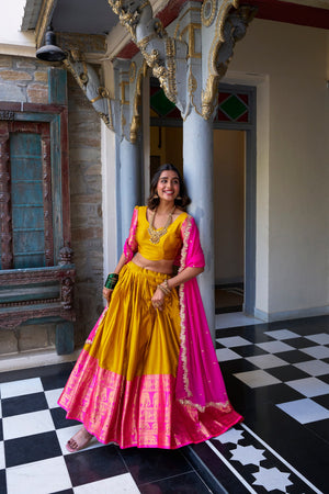 Traditional South Indian half saree mustard yellow with gold zari and rani pink dupatta
