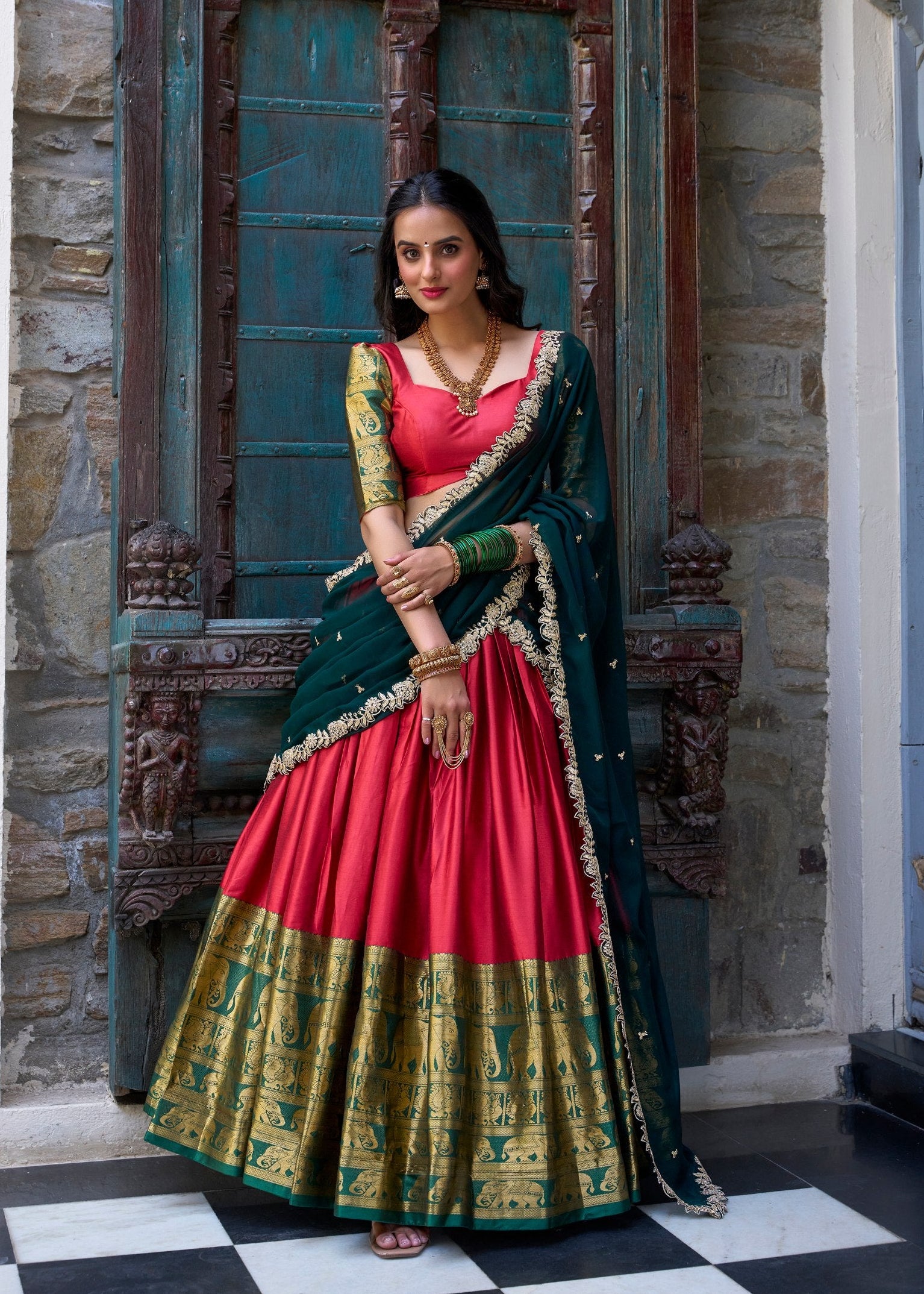 Red Narayan Pattu silk half saree with green and gold zari weaving elephant border
