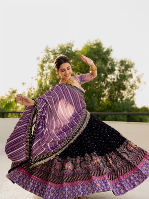 Midnight black and purple heavy malai silk Navratri lehenga choli featuring bandhani digital prints, real mirror work embellishments, and a striped silk dupatta