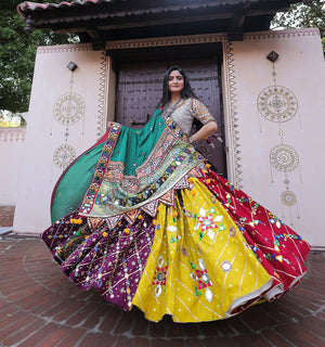Multicolor heavy muslin cotton Navratri lehenga choli featuring yellow, maroon, and purple printed panels with real mirror work and a green border dupatta