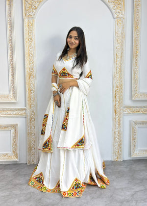 White heavy rayon cotton Navratri chaniya choli with multicolour mirror and patch work border
