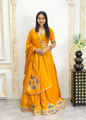 Mustard yellow heavy rayon cotton Navratri chaniya choli with multicolour mirror and patch work border
