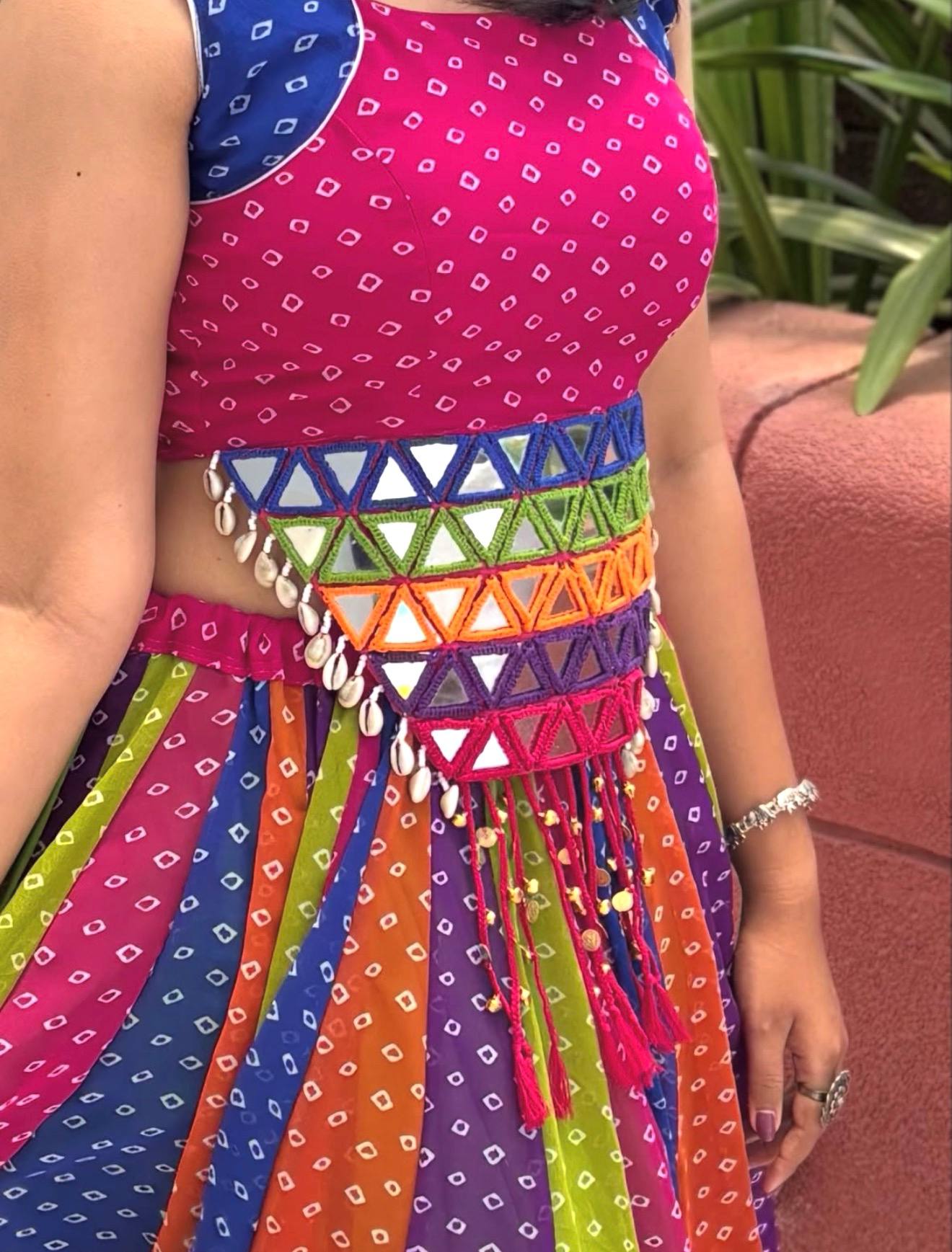Garba chaniya choli rainbow bandhani print with rani pink crop top and kodi belt
