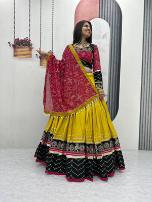 Navratri lehenga yellow black with mirror work border and moti latkan dupatta
