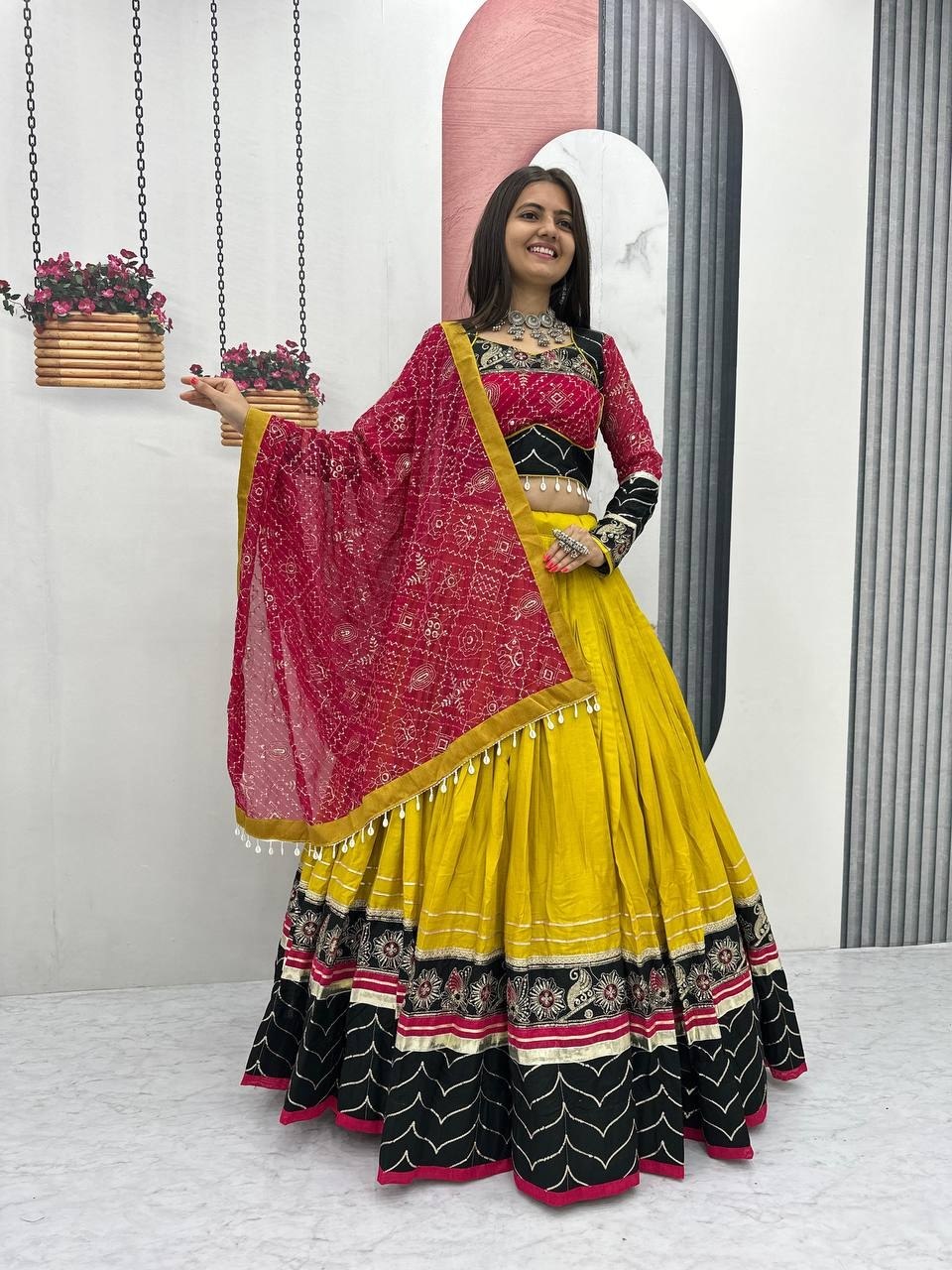 Yellow and black rayon cotton Navratri chaniya choli with mirror and thread work and bandhani dupatta
