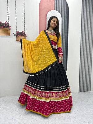 Black and rani pink rayon cotton Navratri chaniya choli with mirror and thread work and bandhani dupatta