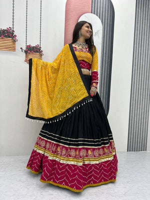 Garba chaniya choli black with rani pink embroidered border and yellow bandhani dupatta
