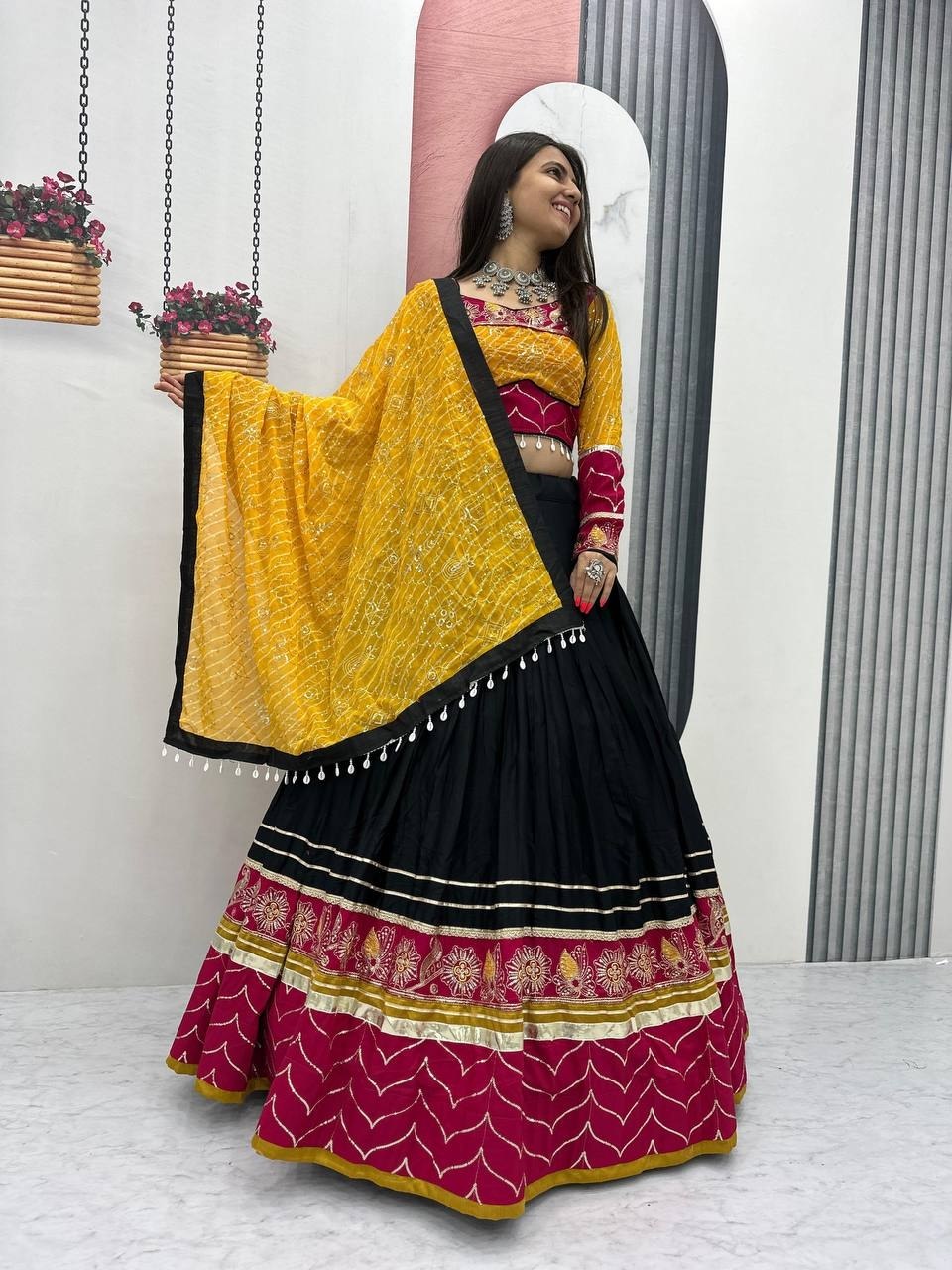 Garba chaniya choli black with rani pink embroidered border and yellow bandhani dupatta
