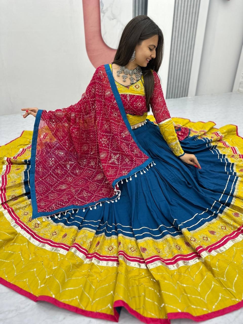 Navratri lehenga teal blue yellow with mirror work border and moti latkan dupatta
