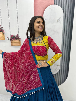 Garba chaniya choli teal blue with yellow embroidered border and rani pink bandhani dupatta
