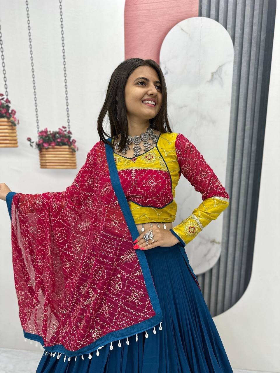 Garba chaniya choli teal blue with yellow embroidered border and rani pink bandhani dupatta
