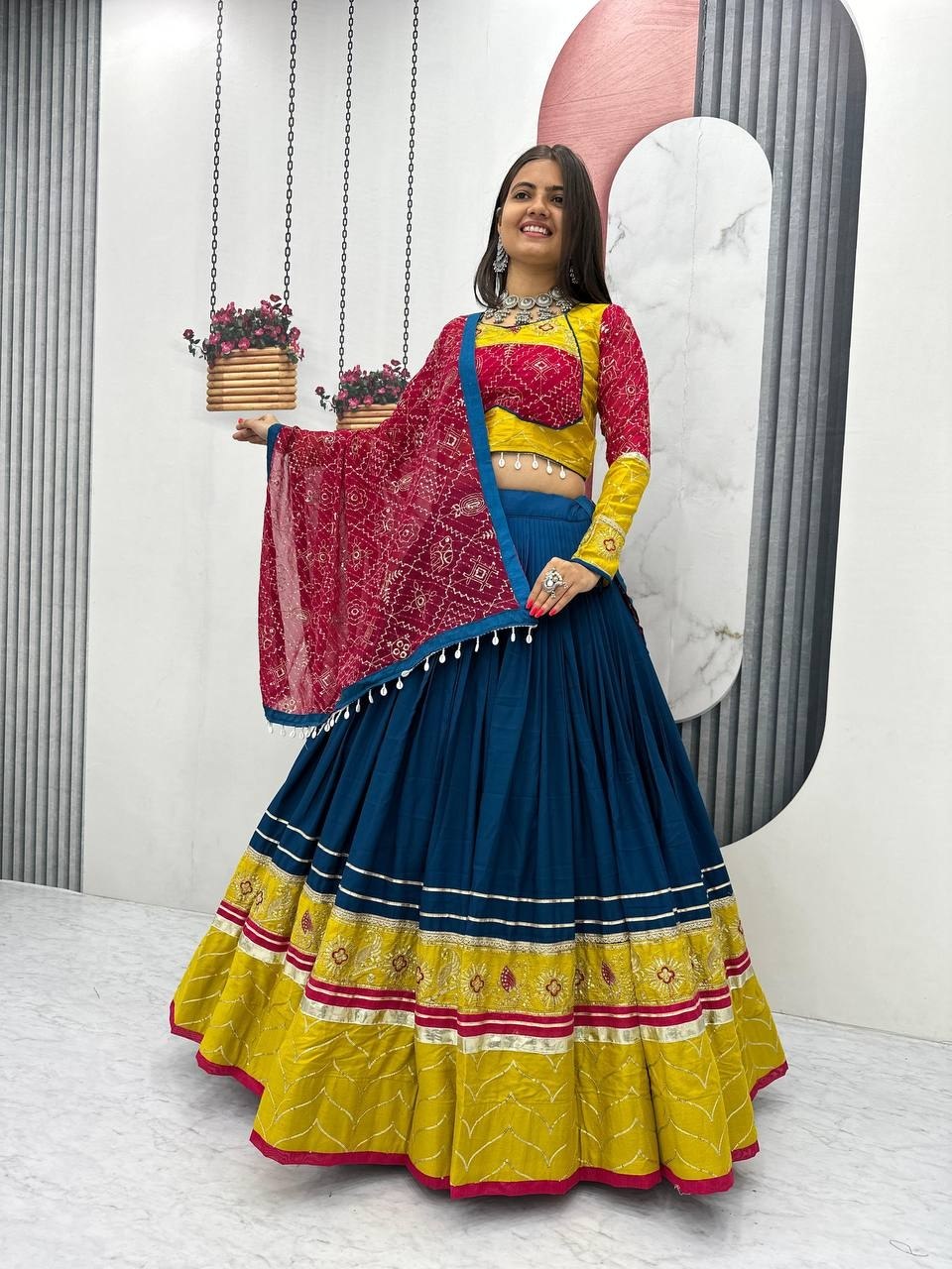 Teal blue and yellow rayon cotton Navratri chaniya choli with mirror and thread work and bandhani dupatta
