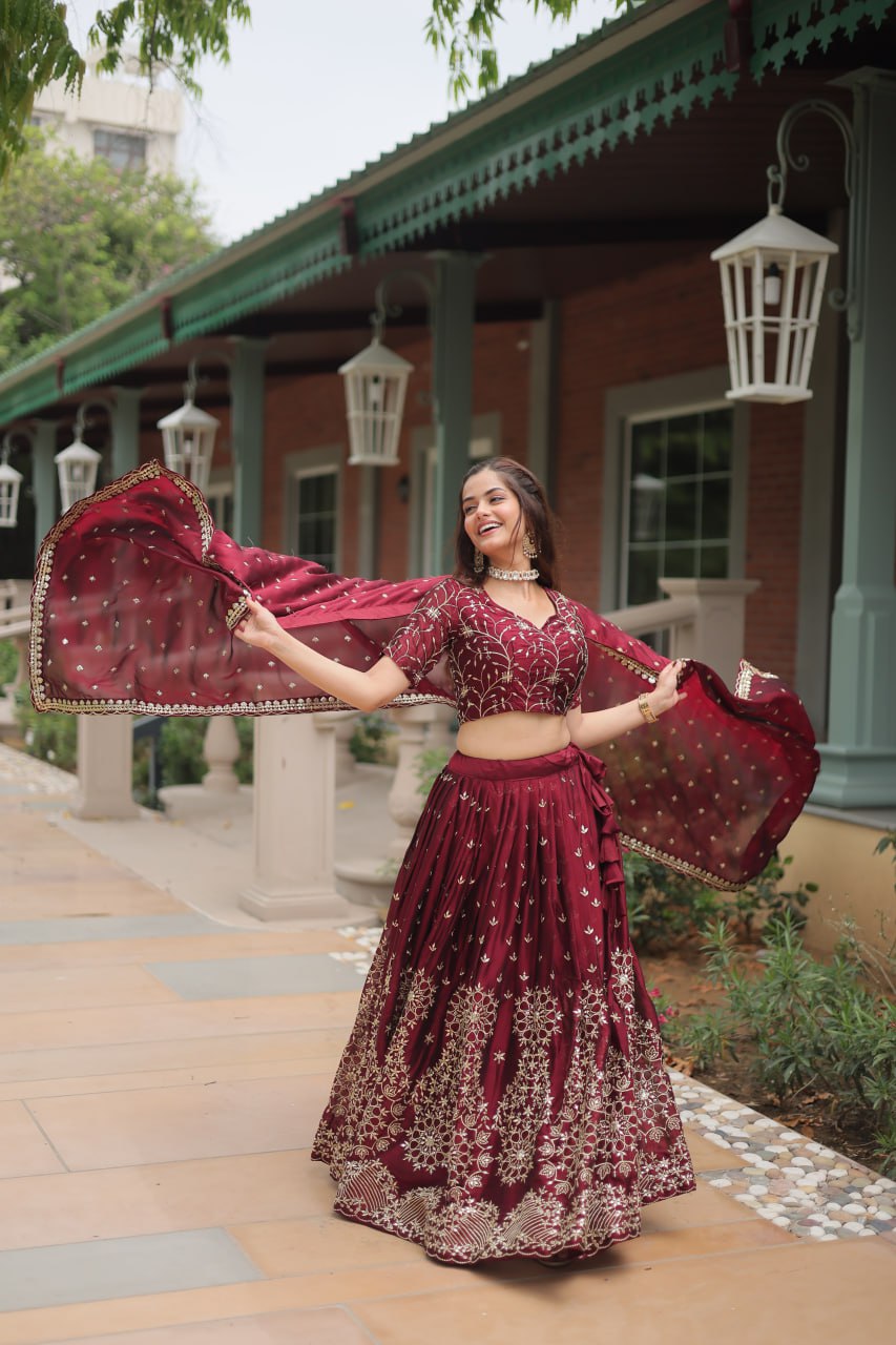 Maroon Color Rangoli Silk With Heavy Sequins And Thread Embroidered Work Lehenga