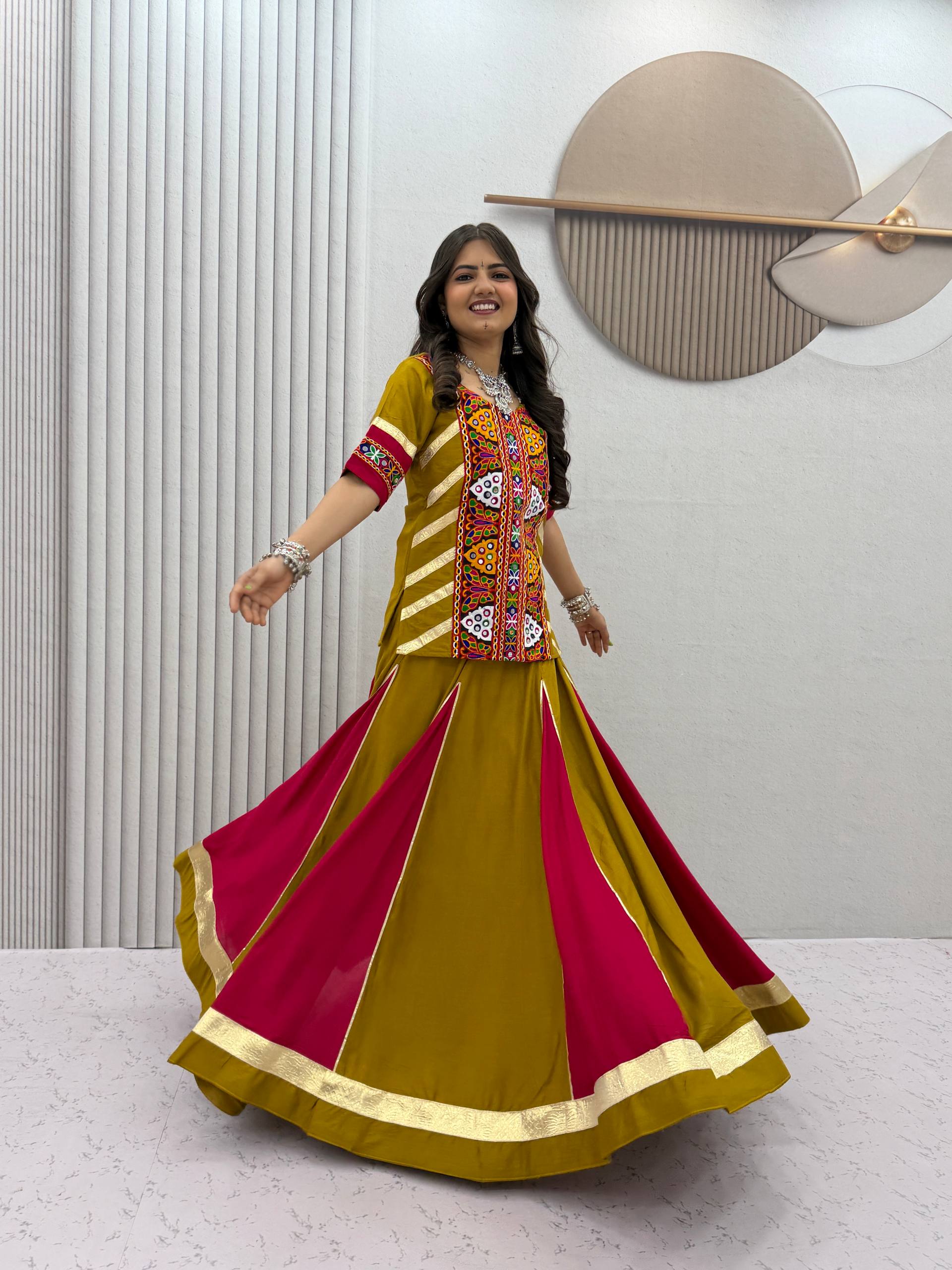 Olive green and rani pink pure cotton Kediyu style Navratri lehenga choli with Kutchi mirror embroidery work and Gota Patti panelled skirt